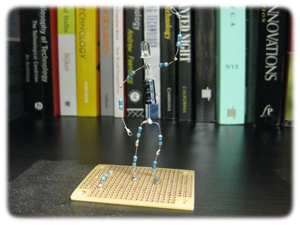 Stick figure made from soldered electrical components